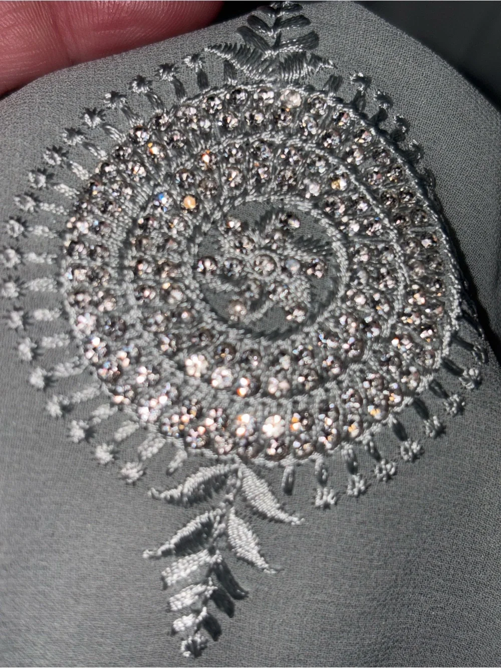 218” Legnth sage green draped saree features delicate silver embroidery